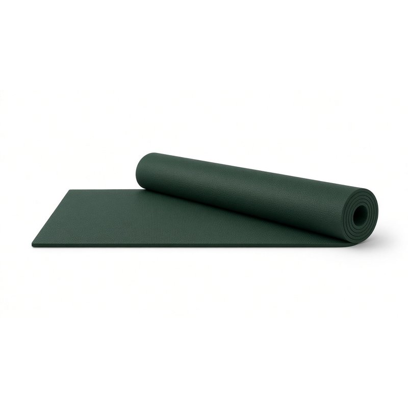 Thick dark green yoga mat, partly rolled, on a white background